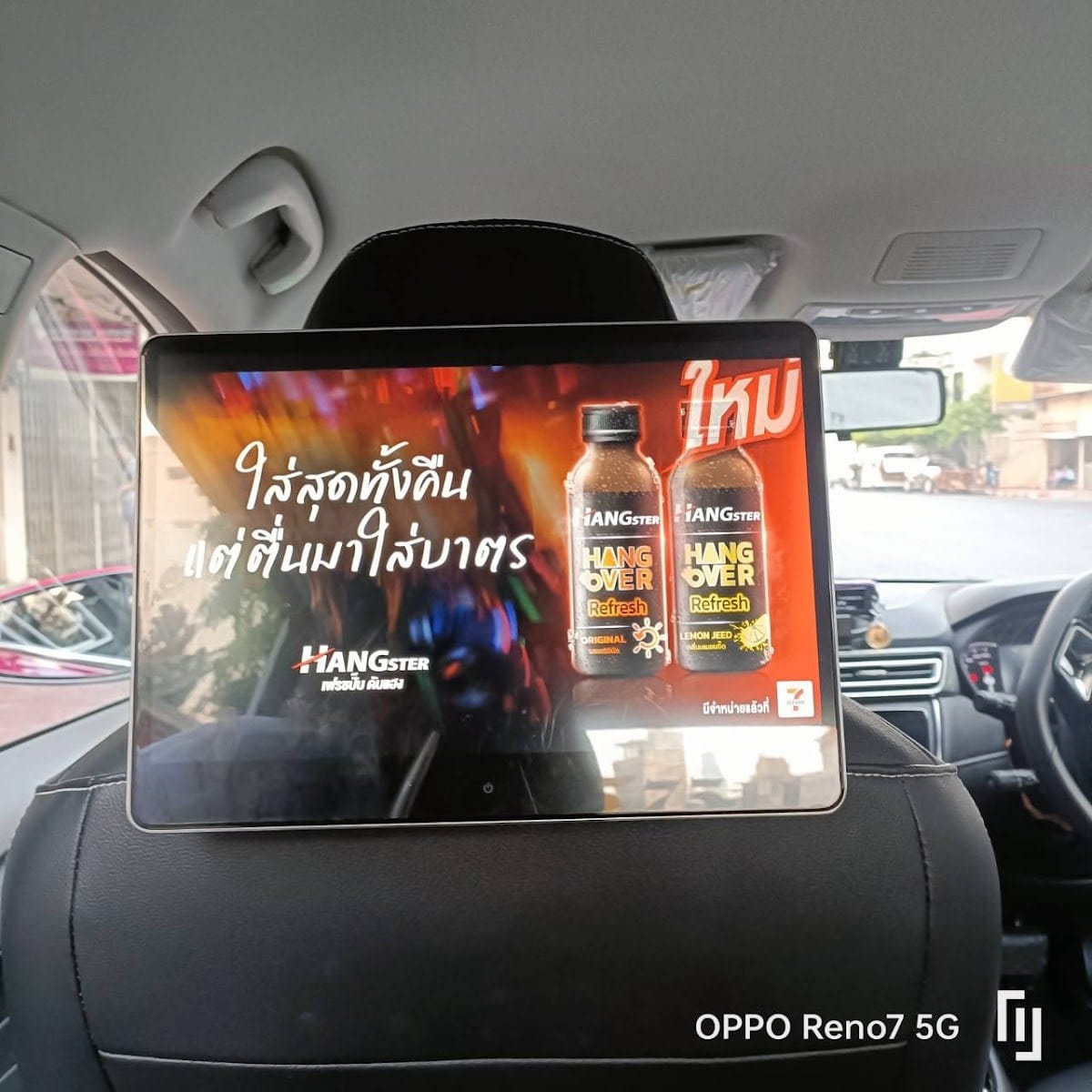 Hangster campaign creative on an in-cabin taxi screen in Bangkok