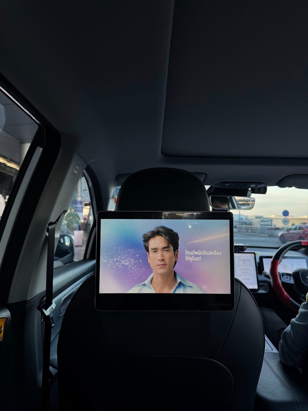 Dr.Pong tone-up skincare ad on a MotionReach taxi headrest screen
