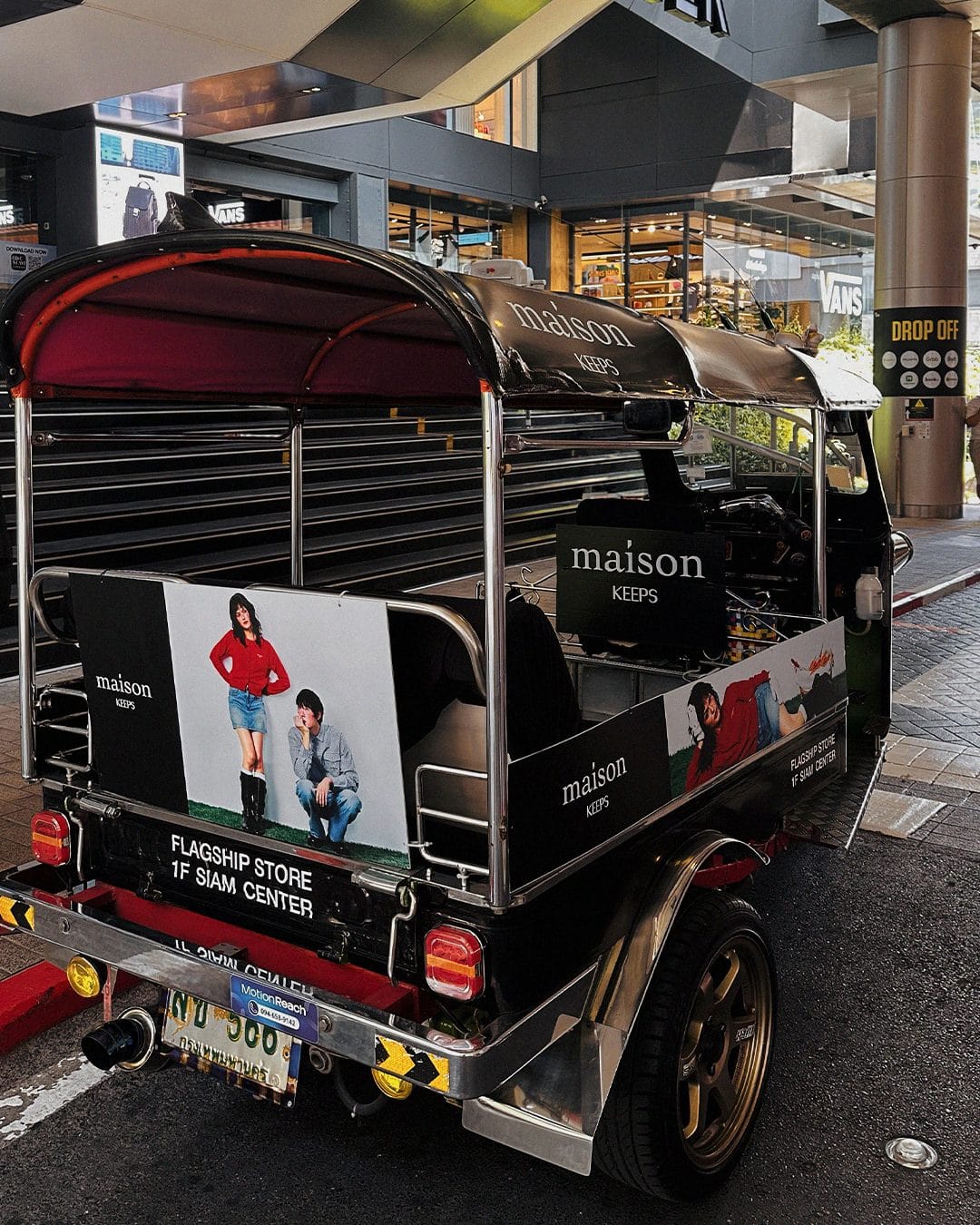 Rear view of the Maison Keeps wrapped tuk-tuk parked at the Siam Center drop-off point