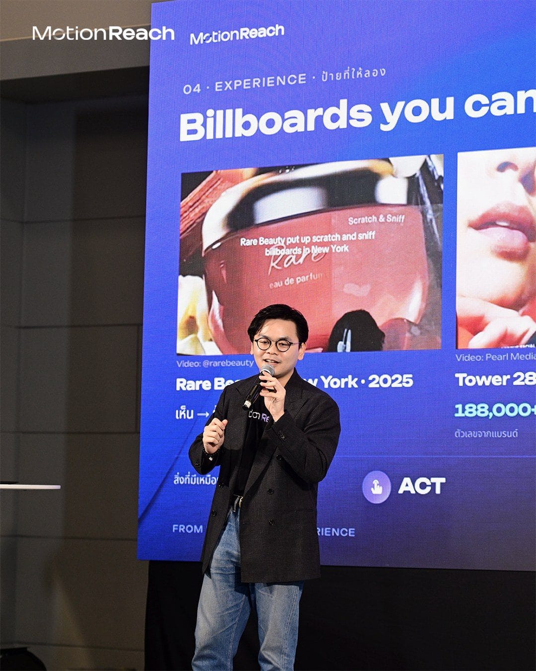 MotionReach speaker on the Showcase Stage in front of a slide about interactive billboards