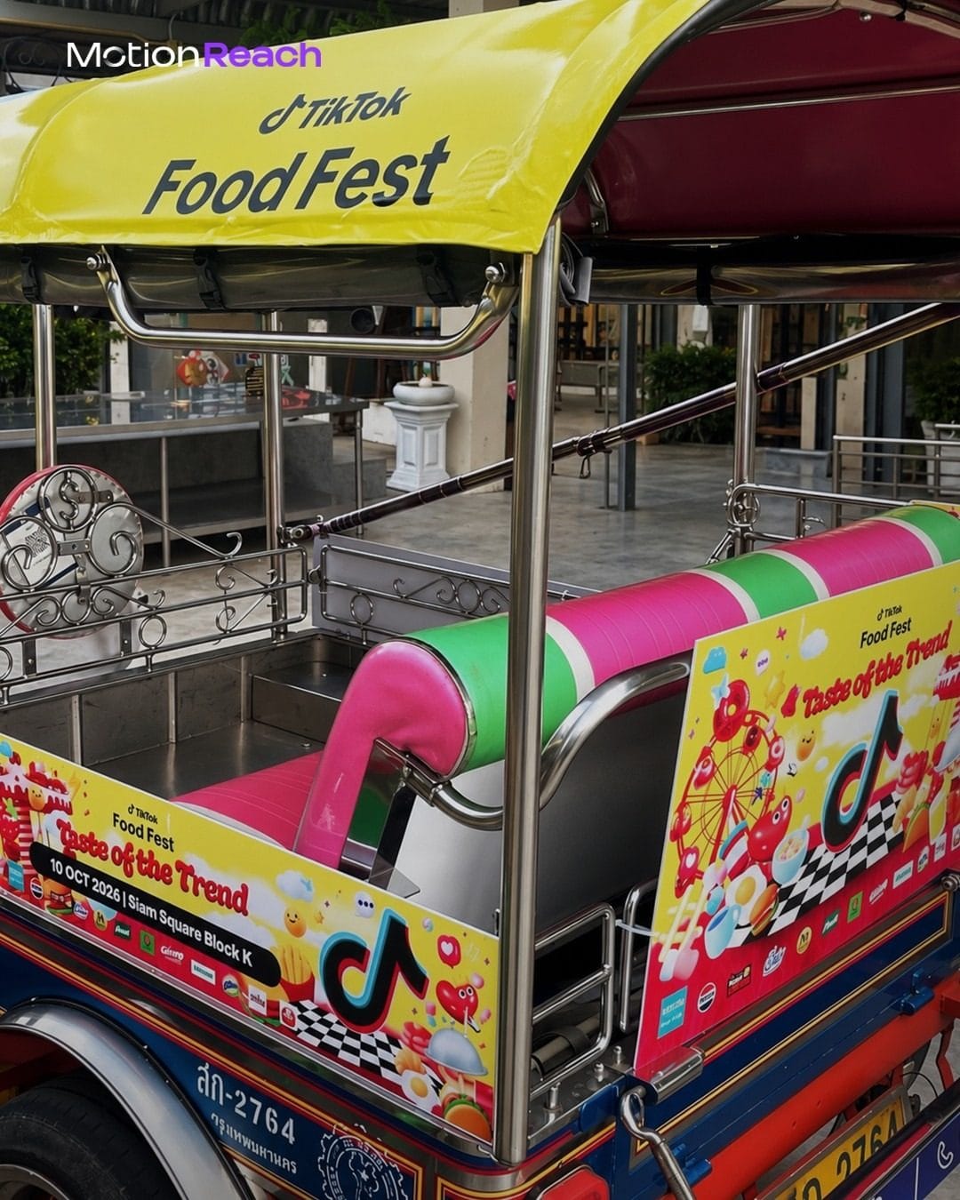 Tuk-tuk passenger area with TikTok Food Fest side panels showing 10 Oct 2026, Siam Square Block K