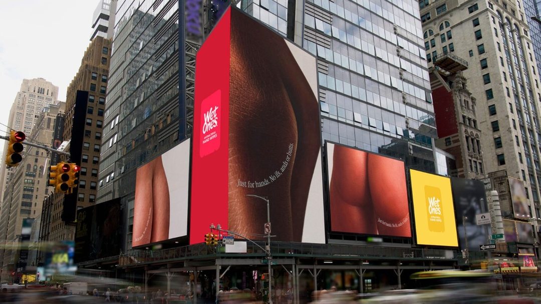 Wet Ones Just for Hands screens in Times Square showing close-up hands that look like bottoms